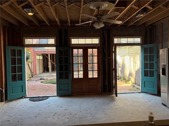 entryway featuring french doors, ceiling fan, and plenty of natural light