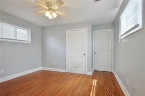 unfurnished bedroom with hardwood / wood-style flooring and ceiling fan