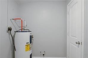 utility room with water heater