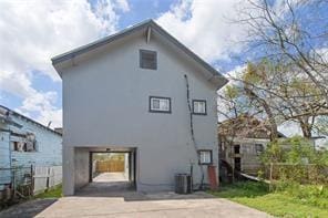 rear view of house with central air condition unit