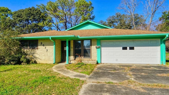 ranch-style home with a garage and a front lawn