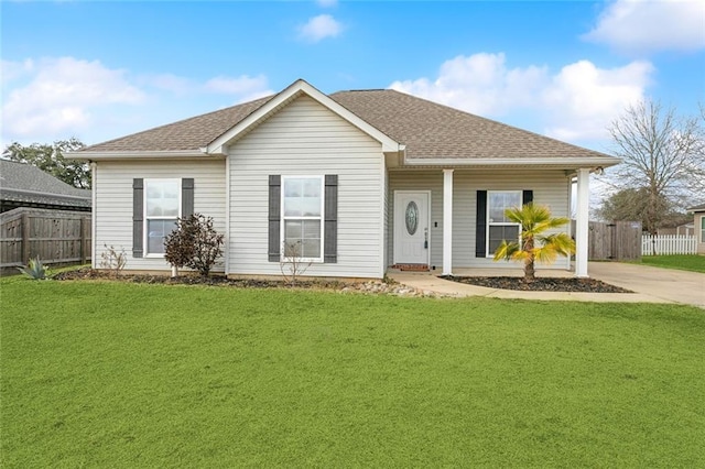 view of front facade with covered porch and a front yard