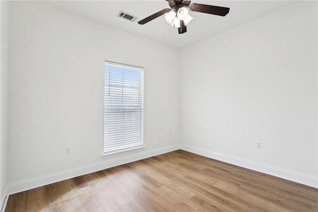 spare room featuring ceiling fan and light hardwood / wood-style flooring