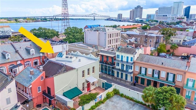 birds eye view of property with a water view