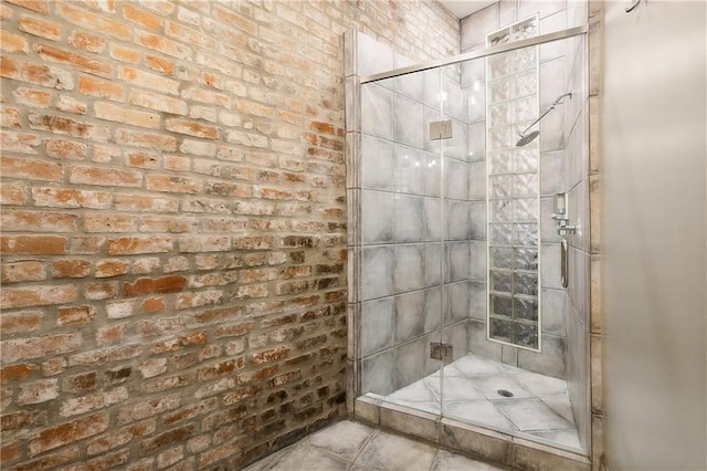 bathroom with brick wall