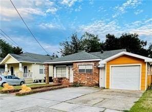 single story home featuring a garage