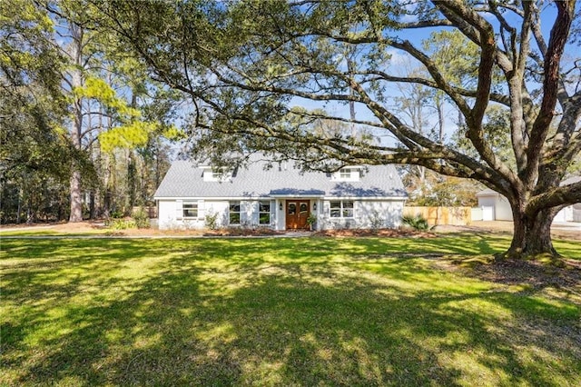 single story home with a garage and a front lawn