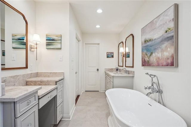 bathroom featuring vanity and a tub