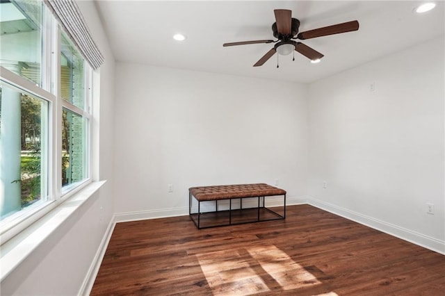 spare room with ceiling fan and dark hardwood / wood-style floors