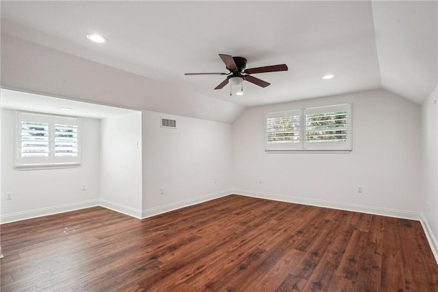 additional living space featuring ceiling fan, lofted ceiling, and dark hardwood / wood-style floors