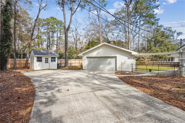 view of side of property with a garage and a storage unit