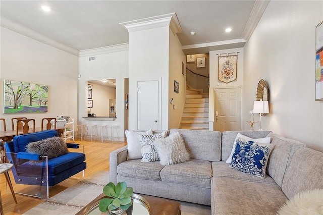 living room featuring hardwood / wood-style floors and ornamental molding