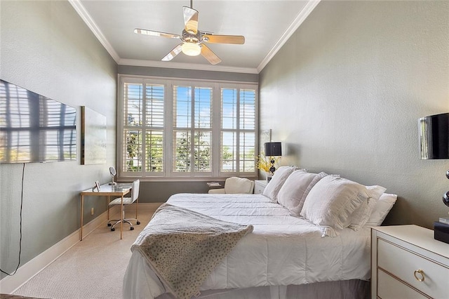 carpeted bedroom with ornamental molding and ceiling fan