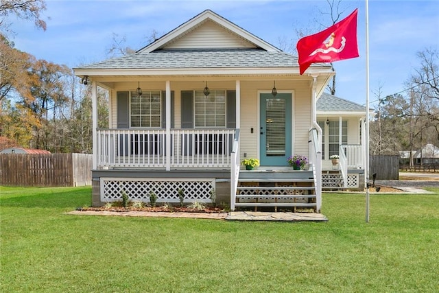 view of front of house featuring a front lawn and covered porch