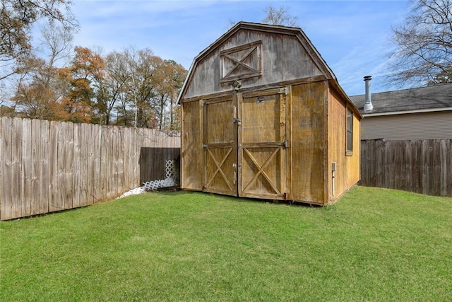 view of outbuilding with a lawn