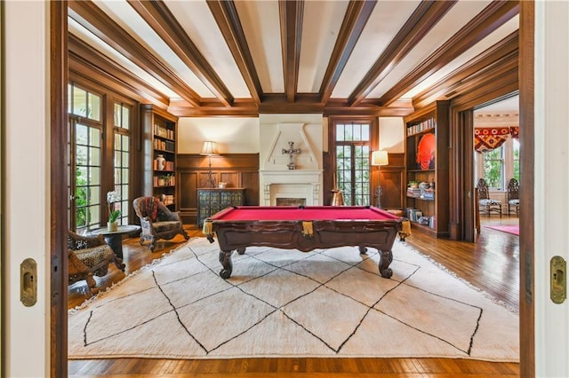 playroom featuring wood-type flooring, a fireplace, billiards, and beamed ceiling