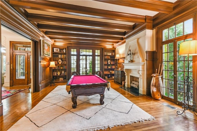 rec room featuring beamed ceiling, pool table, wood-type flooring, and ornamental molding