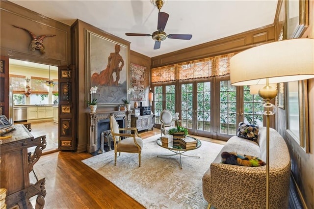 living room with ceiling fan, a fireplace, and dark hardwood / wood-style flooring