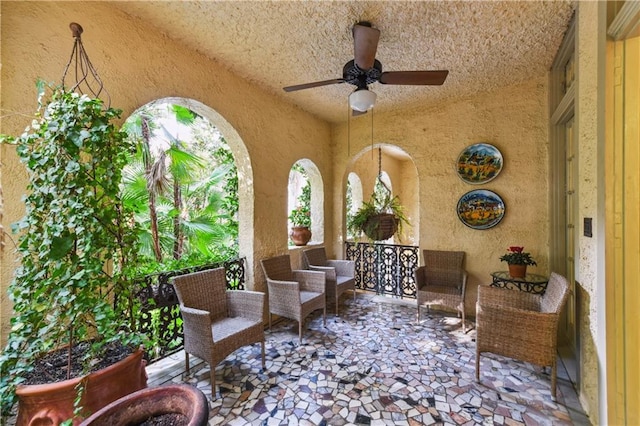 view of patio / terrace featuring an outdoor living space and ceiling fan