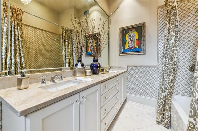 bathroom featuring tile patterned flooring, vanity, and shower / bathtub combination with curtain