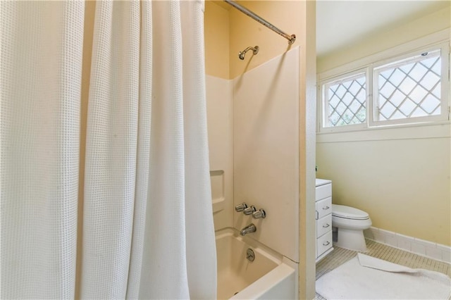 full bathroom featuring vanity, toilet, tile patterned flooring, and shower / bath combo with shower curtain