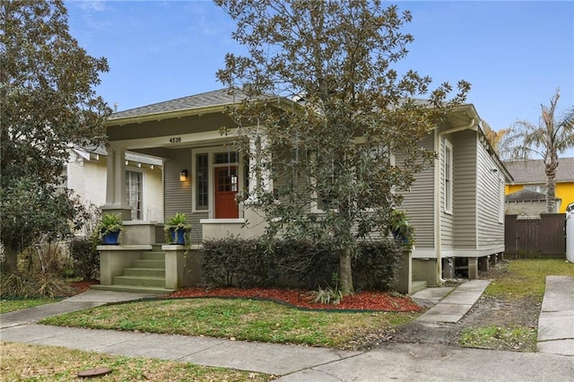 bungalow with a front yard