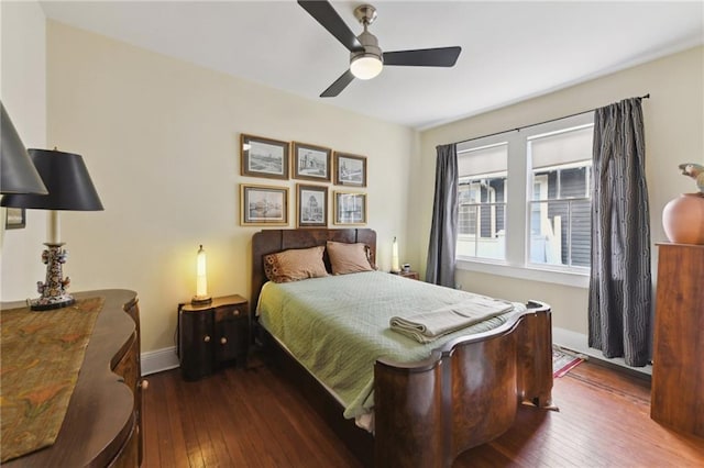 bedroom featuring dark hardwood / wood-style floors and ceiling fan