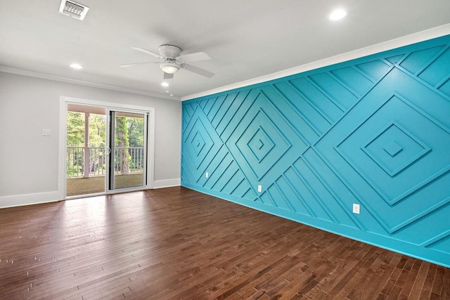 spare room with crown molding, ceiling fan, and dark hardwood / wood-style flooring