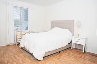 bedroom with light wood-type flooring