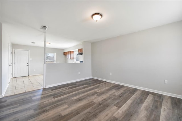 unfurnished room with light wood-type flooring