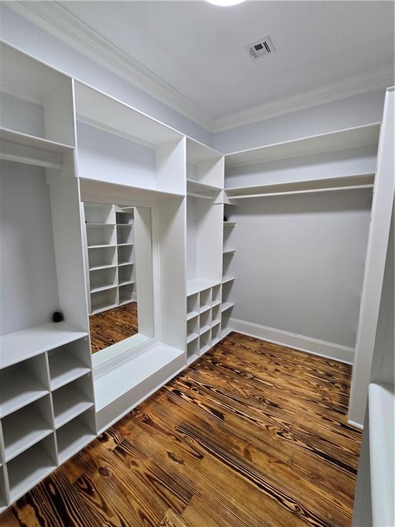 spacious closet featuring hardwood / wood-style floors