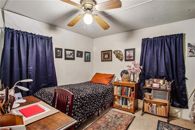 bedroom with ceiling fan and carpet flooring