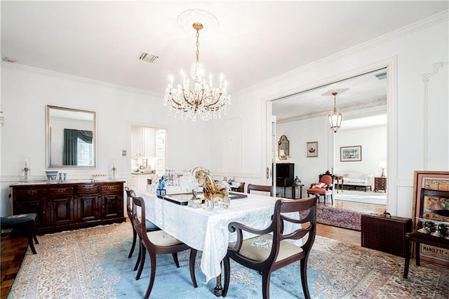 1201 Moss Ln, River Ridge, LA 70123 - dining room featuring ornamental molding, parquet floors, and a notable chandelier