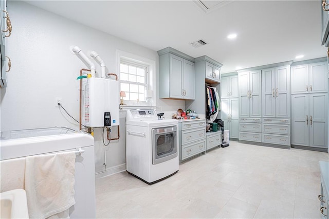 1201 Moss Ln, River Ridge, LA 70123 - laundry area featuring washer / clothes dryer, cabinets, and water heater