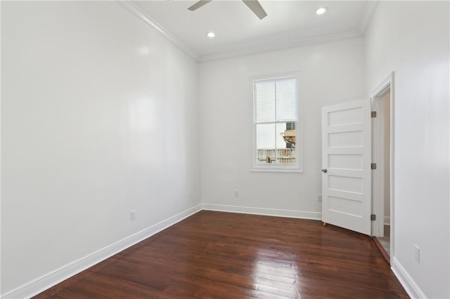 empty room with baseboards and dark wood-style floors