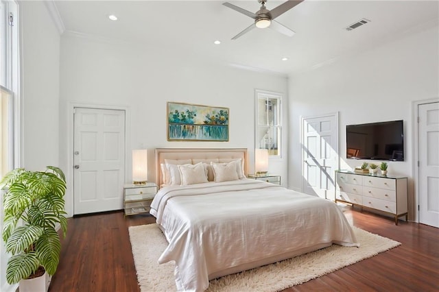 bedroom with wood finished floors, visible vents, recessed lighting, ceiling fan, and crown molding