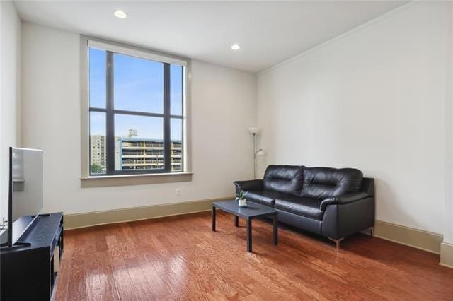 living area with hardwood / wood-style flooring