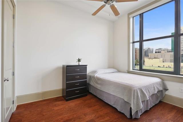 bedroom featuring ceiling fan and dark hardwood / wood-style flooring