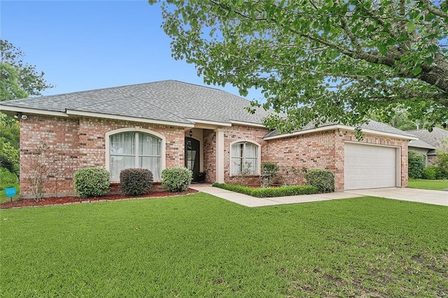 ranch-style home featuring a garage and a front lawn