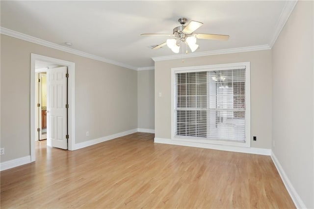 spare room with ornamental molding, ceiling fan, and light wood-type flooring