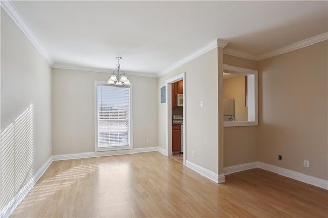 unfurnished room with a notable chandelier, crown molding, and light hardwood / wood-style floors