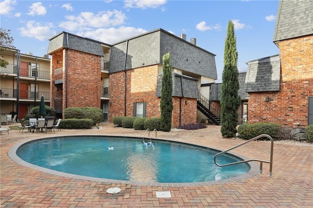 view of pool with a patio