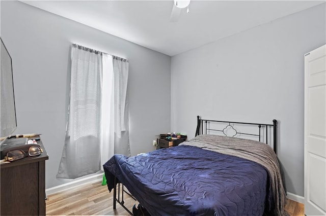 bedroom featuring ceiling fan and light hardwood / wood-style floors