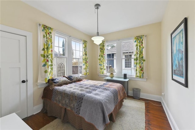 bedroom featuring dark wood-type flooring