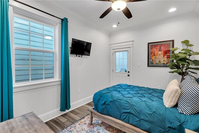 bedroom with crown molding, ceiling fan, and wood-type flooring