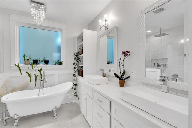 bathroom with an inviting chandelier, vanity, and plus walk in shower