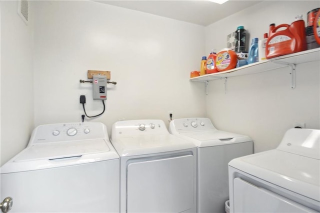 laundry room with laundry area, independent washer and dryer, and visible vents