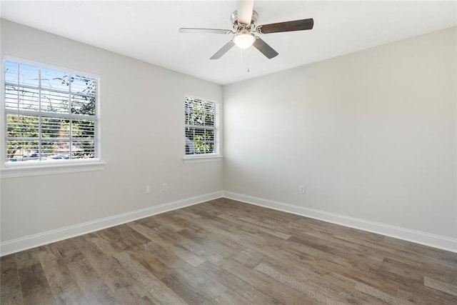 unfurnished room featuring hardwood / wood-style floors, a healthy amount of sunlight, and ceiling fan