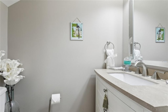 bathroom with vanity and toilet