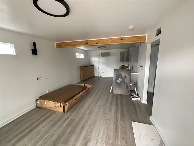 interior space with gray cabinetry, sink, hardwood / wood-style flooring, and plenty of natural light